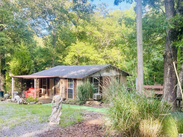 ranch-style house with cooling unit