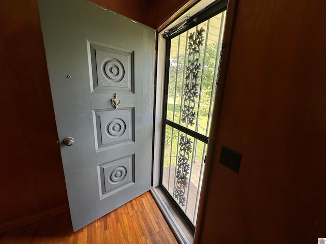 doorway to outside with light hardwood / wood-style floors