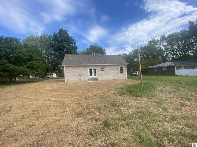 back of house with a patio and french doors