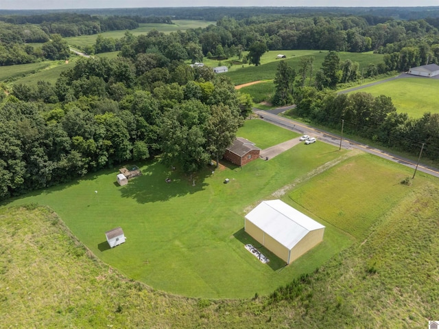 birds eye view of property with a rural view