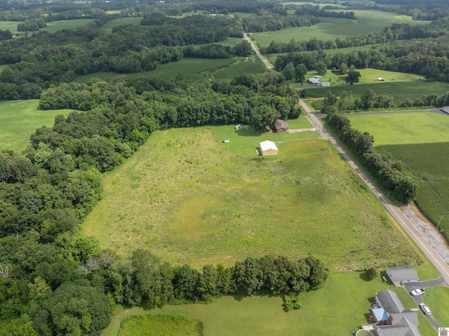 birds eye view of property with a rural view