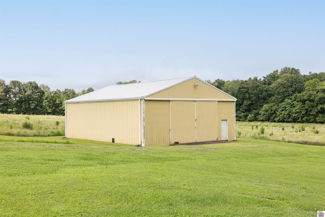 view of outbuilding with a lawn