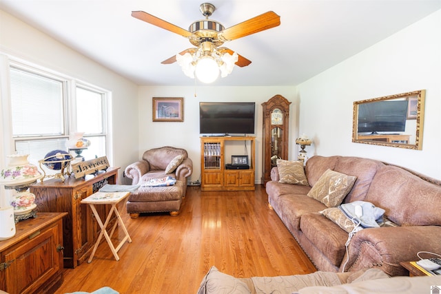 living room featuring light hardwood / wood-style floors and ceiling fan