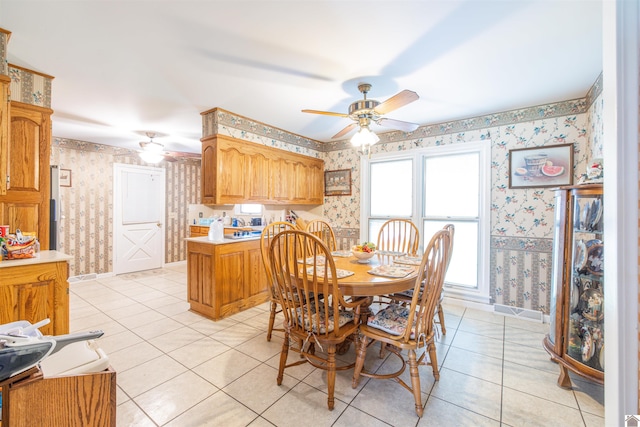 tiled dining room featuring ceiling fan