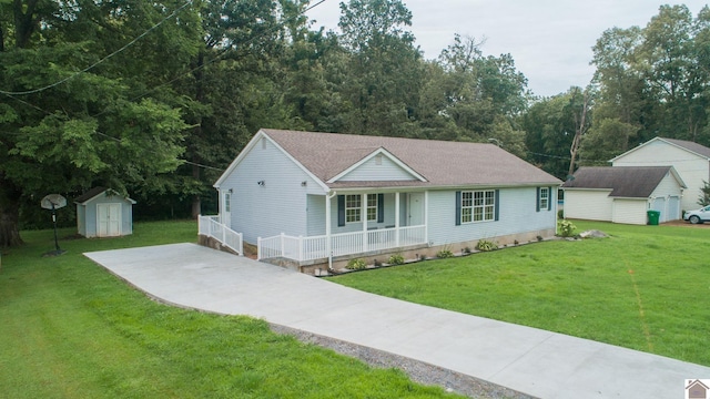 view of front of home featuring covered porch, a front lawn, and a storage unit