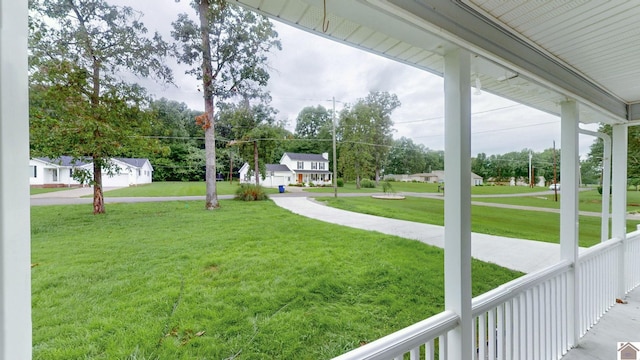 view of yard with covered porch