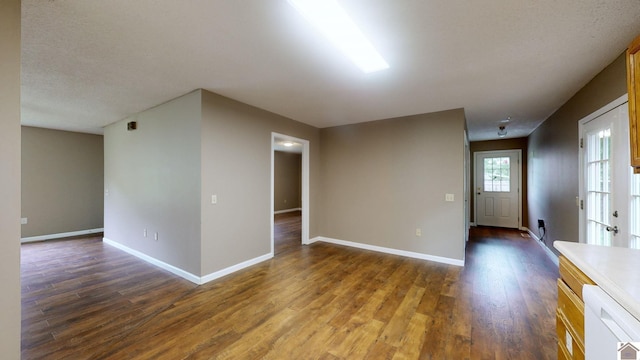 spare room with dark hardwood / wood-style floors