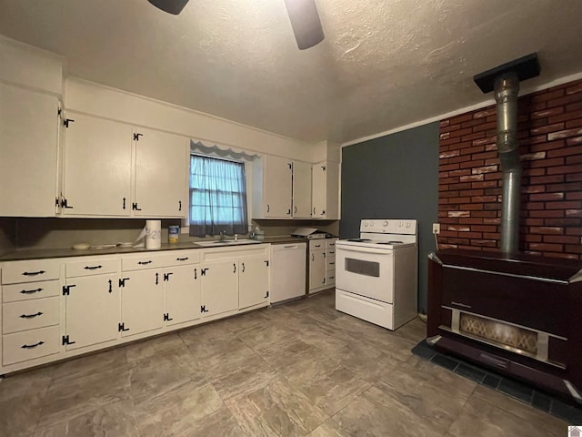 kitchen featuring sink, white cabinetry, ceiling fan, and white appliances