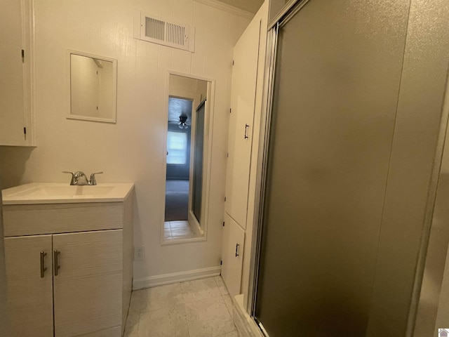 bathroom with a stall shower, vanity, visible vents, and tile patterned floors