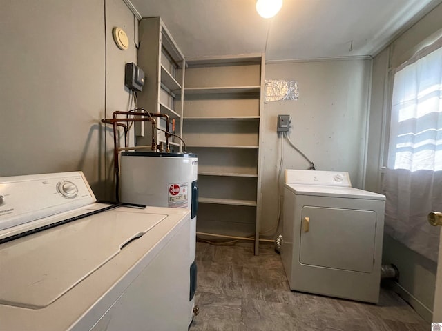 laundry area with water heater, separate washer and dryer, and tile patterned floors