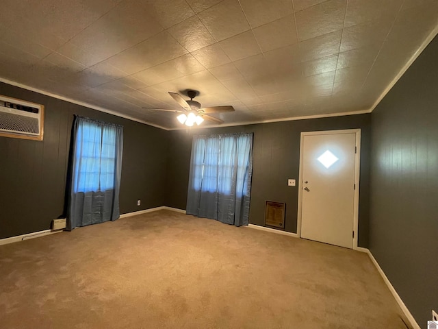 unfurnished room with an AC wall unit, carpet, ceiling fan, and a healthy amount of sunlight