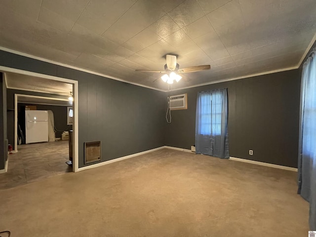 spare room with ceiling fan, baseboards, an AC wall unit, carpet, and crown molding