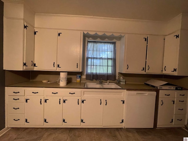 kitchen with white cabinets, white dishwasher, crown molding, and sink