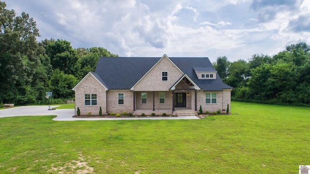 craftsman-style house featuring covered porch and a front yard