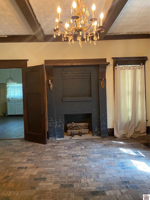 unfurnished living room with beamed ceiling, a notable chandelier, and a textured ceiling