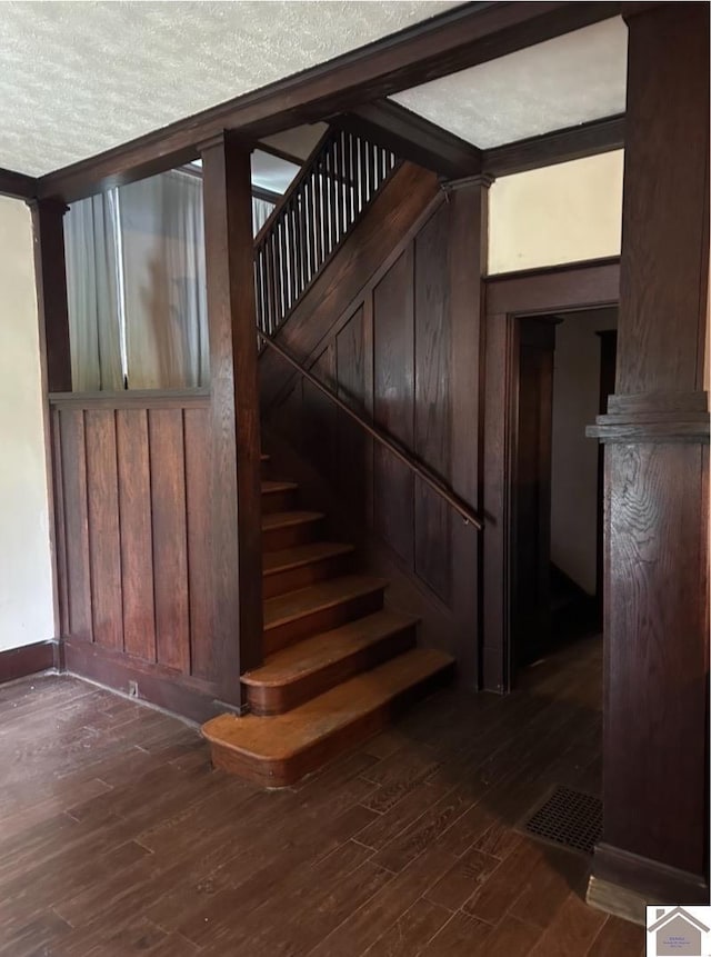 stairway featuring hardwood / wood-style floors