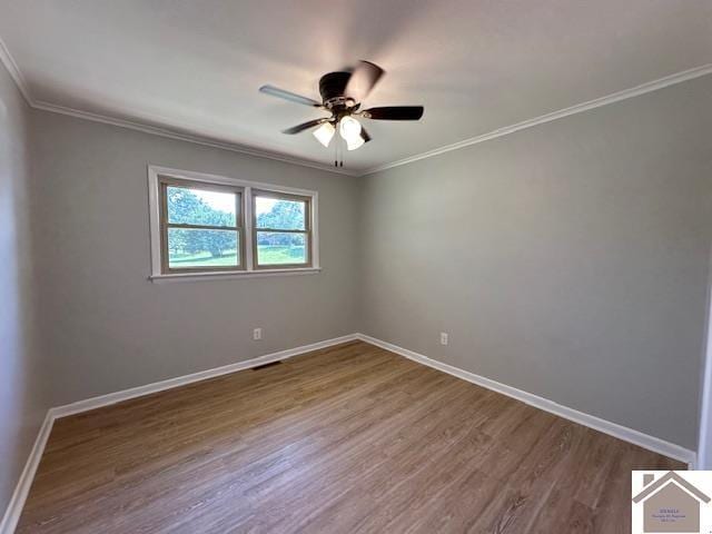 empty room with hardwood / wood-style floors, crown molding, and ceiling fan