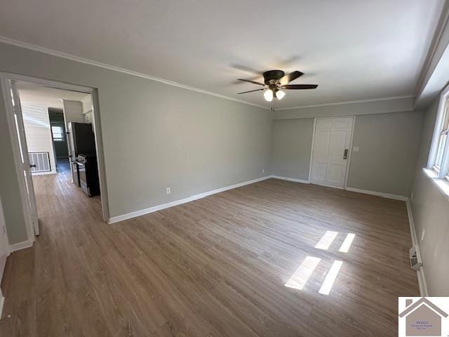 unfurnished room featuring crown molding, ceiling fan, and hardwood / wood-style floors