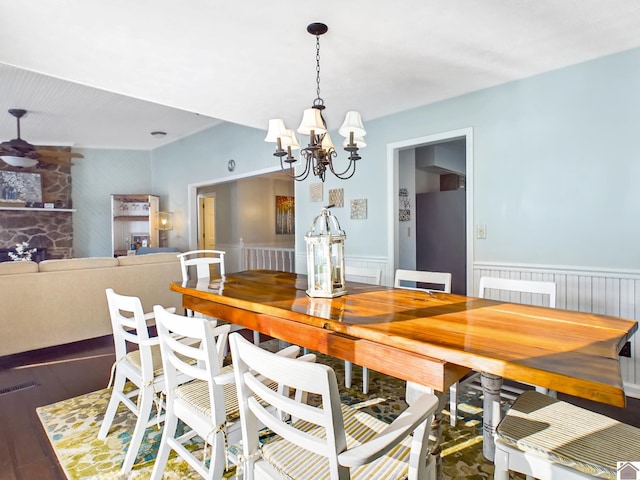 dining space featuring a chandelier and wood-type flooring