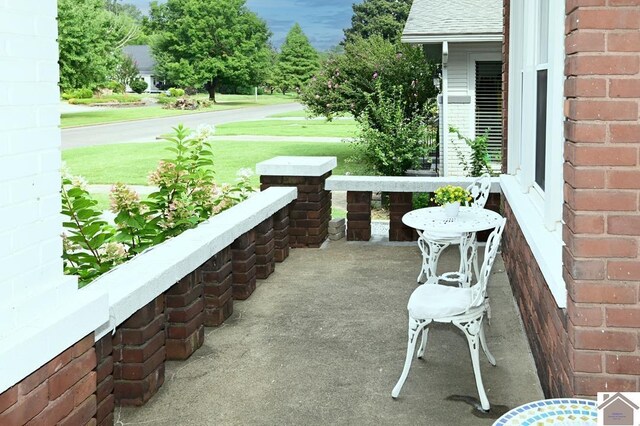 view of exterior entry featuring a porch