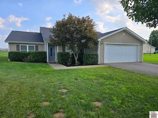 view of front of property featuring a garage and a front lawn