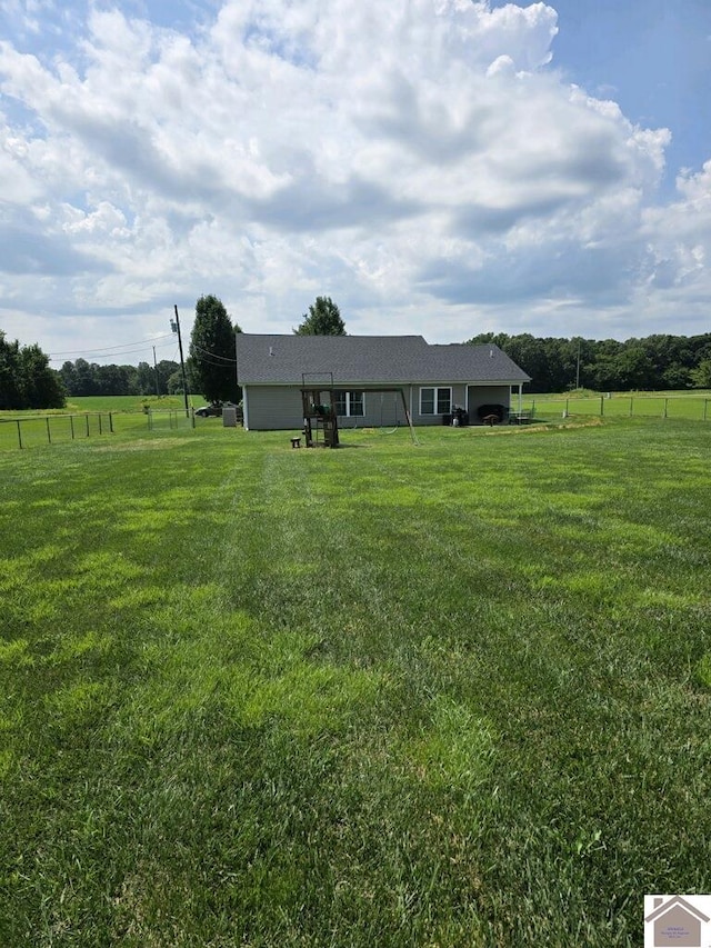 view of yard with a rural view