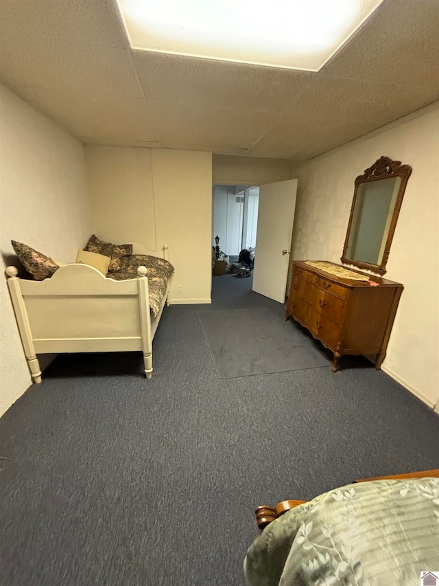 carpeted bedroom featuring a textured ceiling