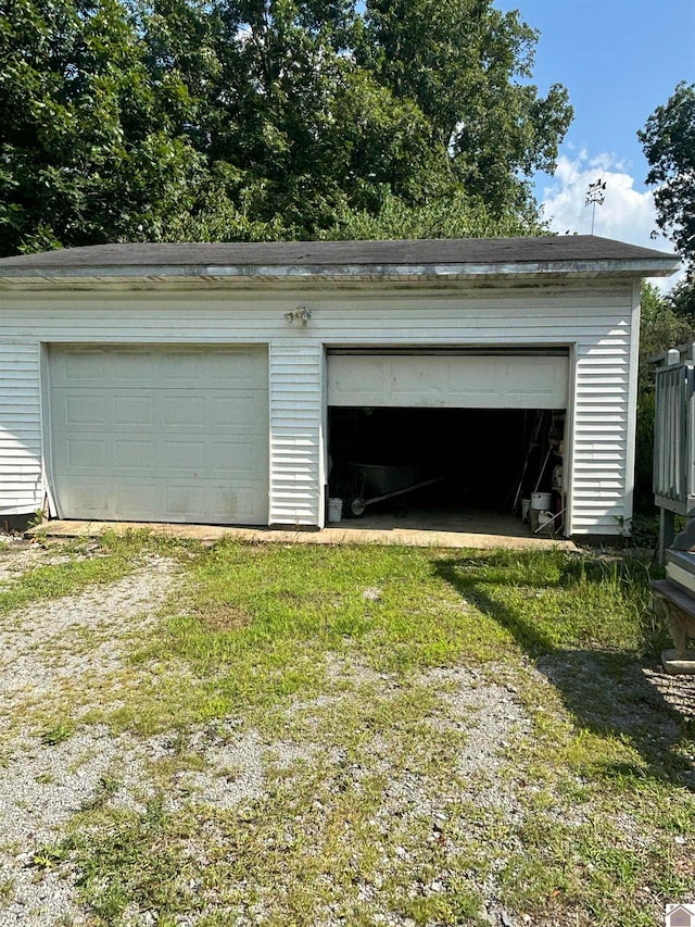 garage featuring a yard