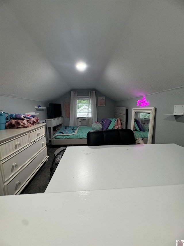 carpeted bedroom featuring vaulted ceiling and cooling unit