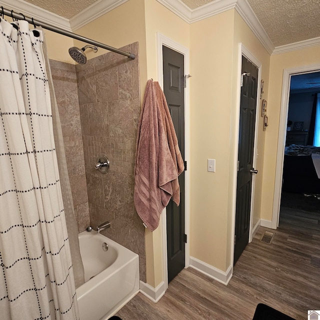 bathroom featuring shower / tub combo, crown molding, and hardwood / wood-style floors