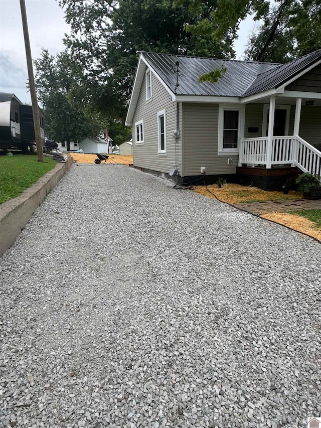 view of property exterior with covered porch