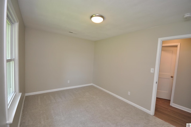 spare room featuring carpet flooring