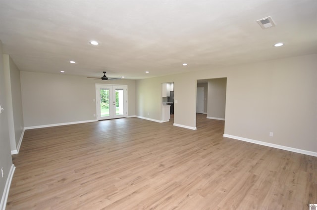 unfurnished room with french doors, ceiling fan, and light hardwood / wood-style floors