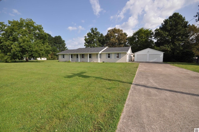 ranch-style home featuring a garage, an outdoor structure, and a front lawn