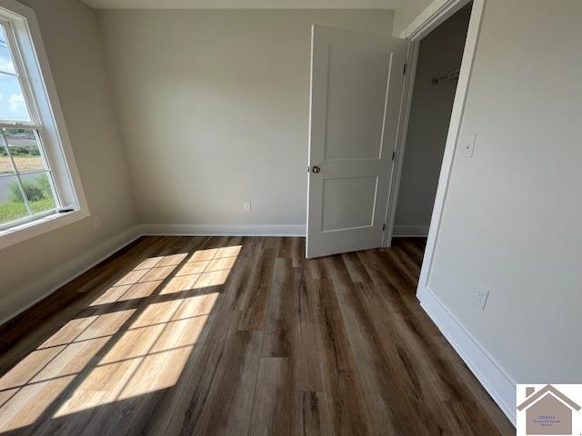 unfurnished room featuring hardwood / wood-style floors