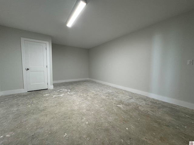 spare room with concrete flooring