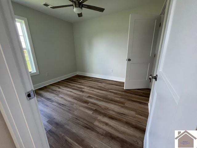 empty room with ceiling fan and hardwood / wood-style flooring