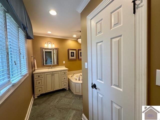 bathroom featuring vanity, tile patterned flooring, crown molding, and a bathtub