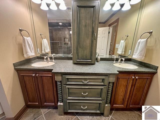 bathroom with dual vanity and tile patterned flooring