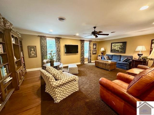 living room featuring crown molding, dark hardwood / wood-style floors, and ceiling fan