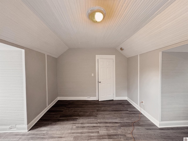 bonus room featuring dark hardwood / wood-style flooring and vaulted ceiling