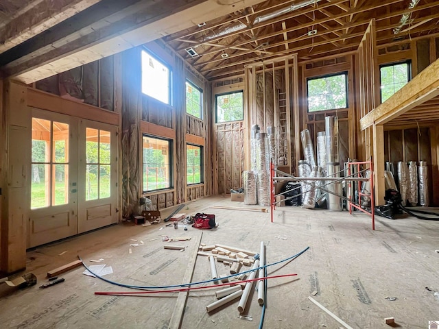 miscellaneous room with french doors and a high ceiling