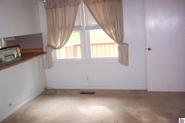 empty room with carpet flooring