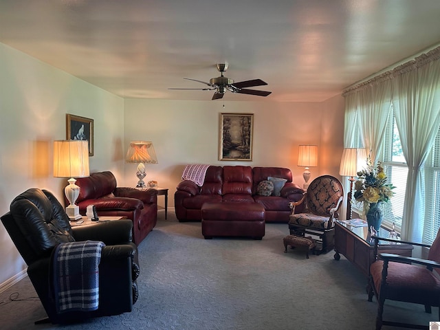 carpeted living room with ceiling fan