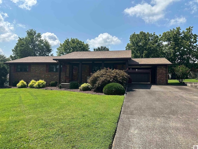 view of front of property with a garage and a front lawn