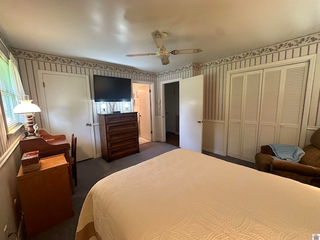 carpeted bedroom featuring ceiling fan and a closet