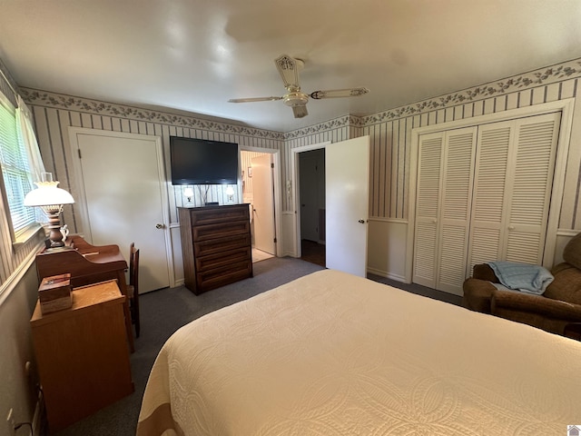 bedroom featuring ceiling fan, dark carpet, and a closet