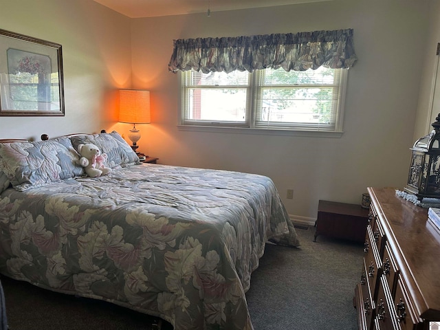 bedroom with dark carpet