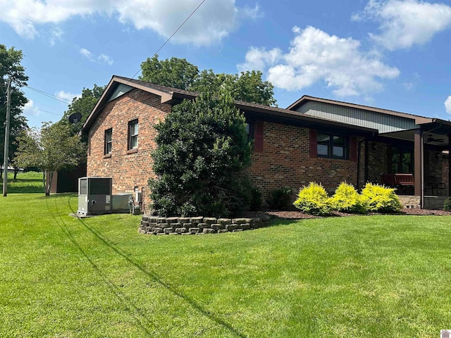 view of home's exterior with a yard