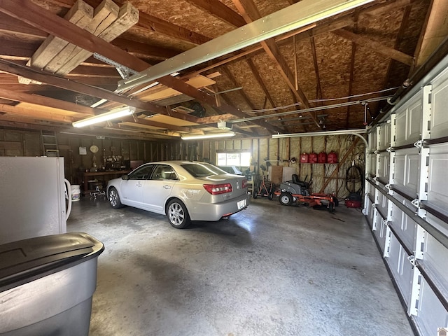 garage featuring white fridge